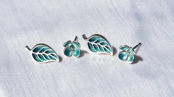 Creative silver stud earrings in form of leaves