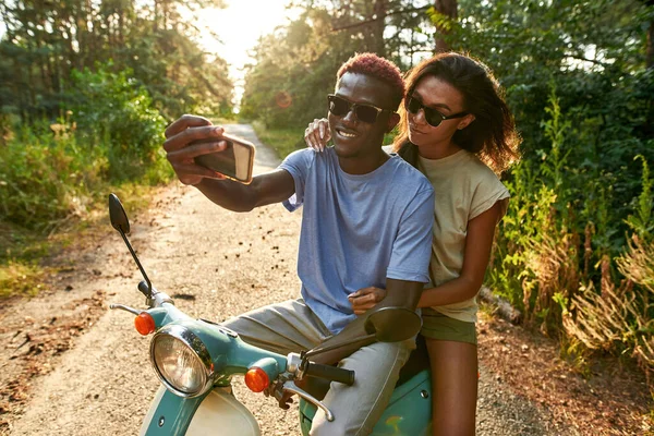 Cheerful african american young spouses taking selfie — Foto de Stock