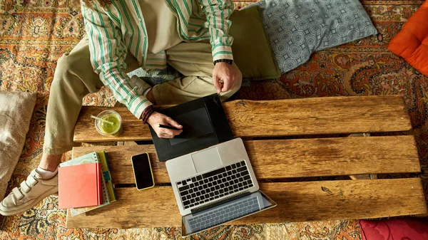 Top view on man working on design on fresh air