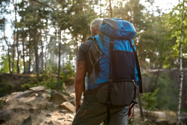 Back view of middle aged caucasian man with backpack — Stock Photo, Image