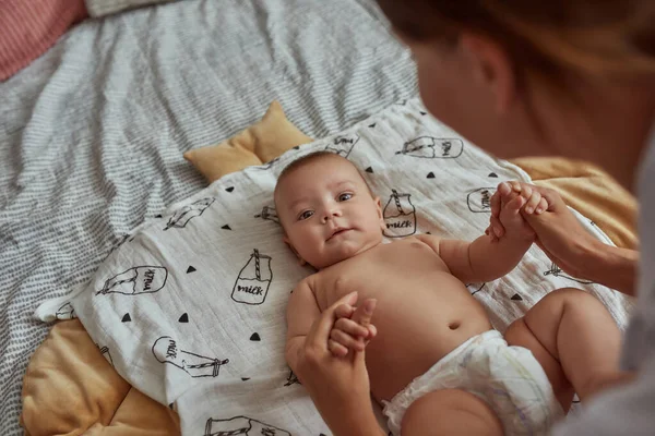 Closeup curious baby without clothes loooking at camera — Stock Photo, Image