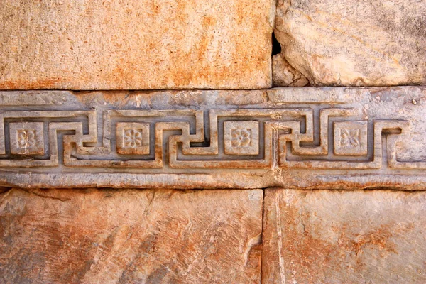 Detail of an architectural decoration with meander ornament — Stock Photo, Image