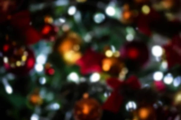 Colorful Christmas balls and bows on the christmas tree — Stock Photo, Image