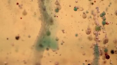 Yağ, su ve renkli mürekkep efervesan karışımı. Balonlar dokunaklı