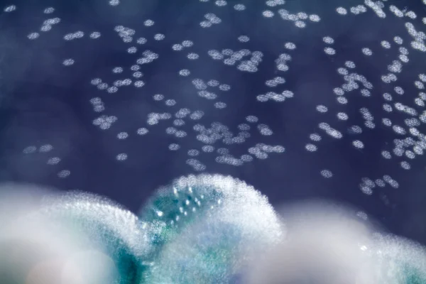 Abstract underwater composition with colorful glass balls, bubbles and light — Stock Photo, Image