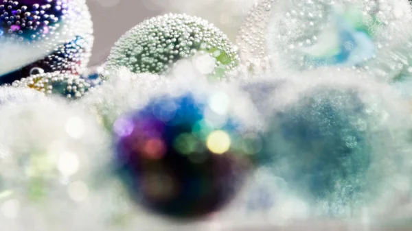 Abstract underwater composition with colorful glass balls, bubbles and light — Stock Photo, Image