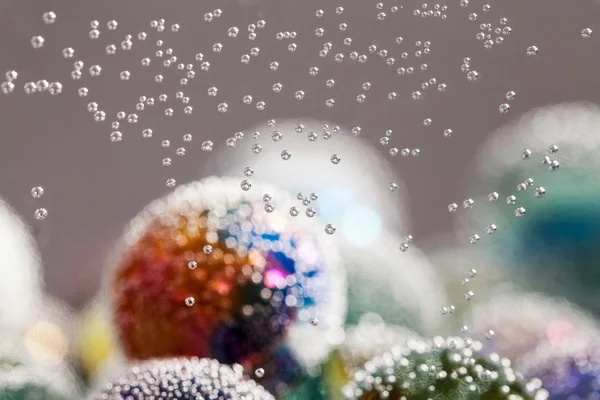 Abstract underwater composition with colorful glass balls, bubbles and light — Stock Photo, Image