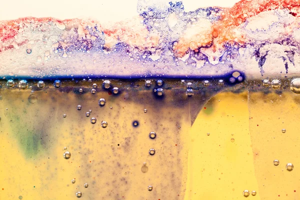 Abstract composition with mix of oil, water and colorful ink with bubbles — Stock Photo, Image