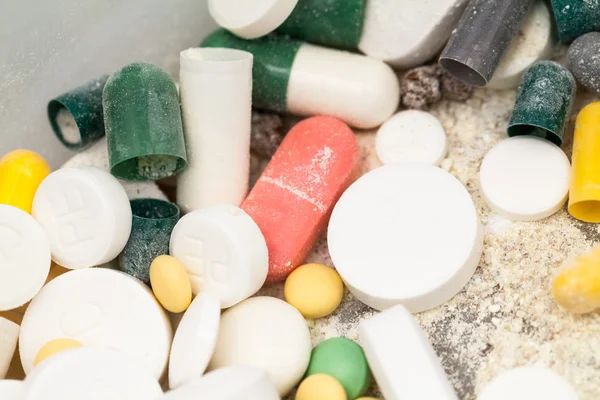 Composition with colorful pills and broken capsules — Stock Photo, Image