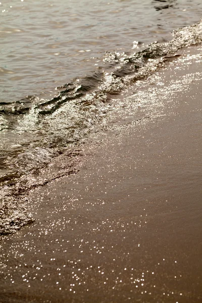 Morskie fale i piasek zbliżenie — Zdjęcie stockowe