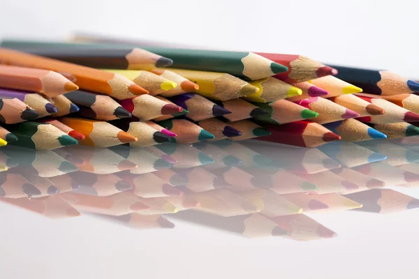 Group of sharp colored pencils with white background and reflexions — Stock Photo, Image