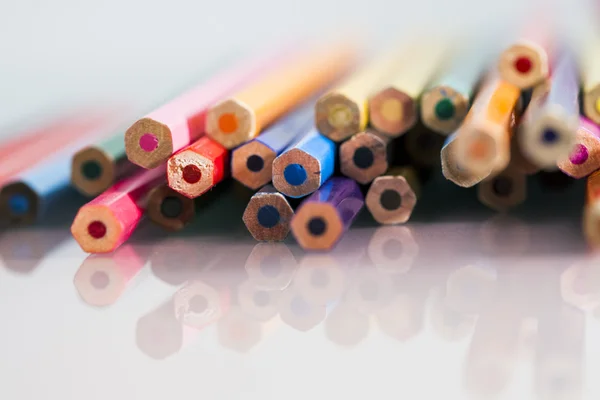 Group of pointless colored pencils with details and reflexions on white background — Stock Photo, Image