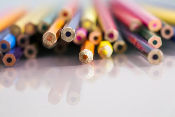 Group of pointless colored pencils with details and reflexions on white background — Stock Photo, Image