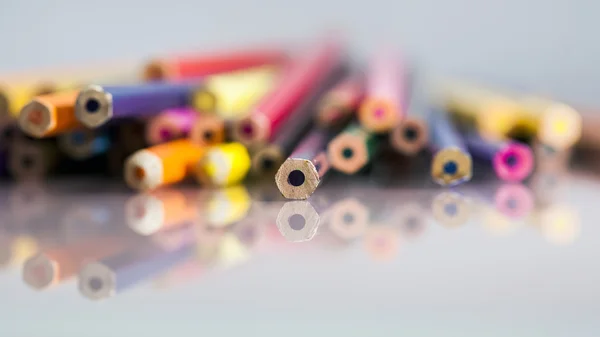 Group of pointless colored pencils with details and reflexions on white background — Stock Photo, Image