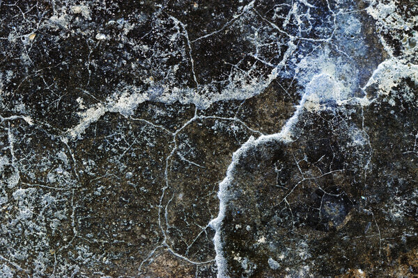 Concrete surface with cracks - texture and background - inverted colors
