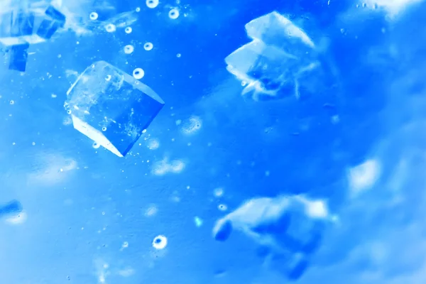 Abstract composition with sugar cubes in a jar with sweetness (inverted colors). It looks like water with bubbles and ice cubes — Stock Photo, Image