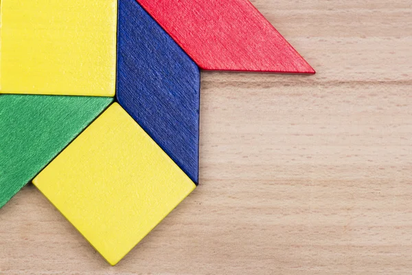 Colorful wooden pieces for tangram technique — Stock Photo, Image