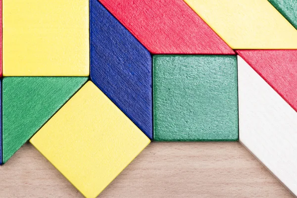 Colorful wooden pieces for tangram technique — Stock Photo, Image