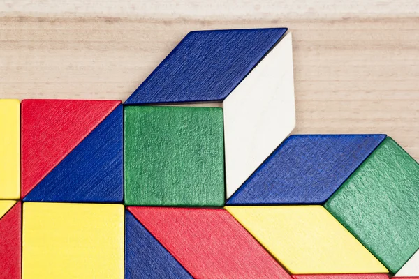 Colorful wooden pieces for tangram technique — Stock Photo, Image
