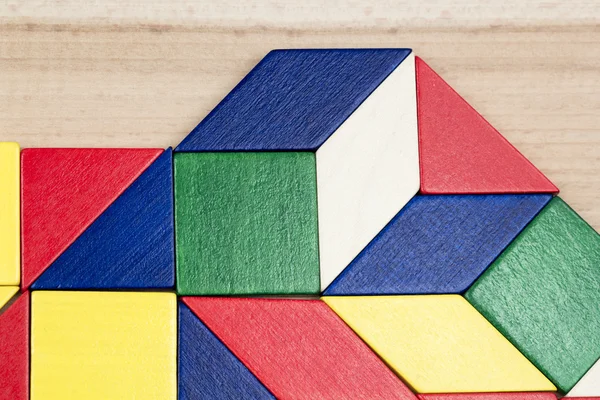 Colorful wooden pieces for tangram technique — Stock Photo, Image