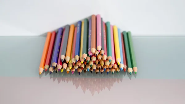 Group of sharp colored pencils with white background and reflexions — Stock Photo, Image