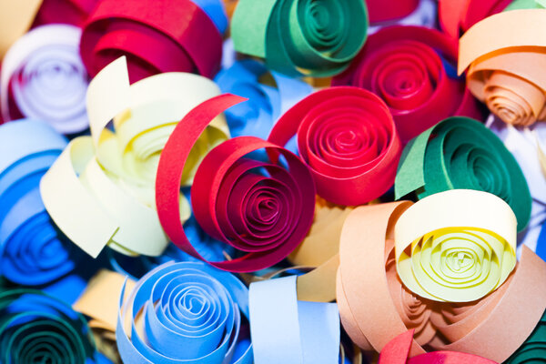 Macro, abstract, background picture of colored paper spirals on paper background