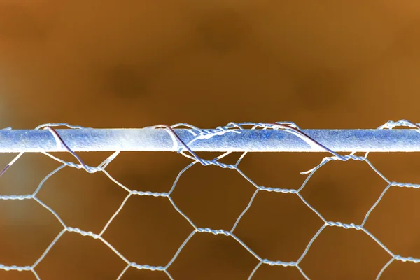 Woven rusty wire fence - texture