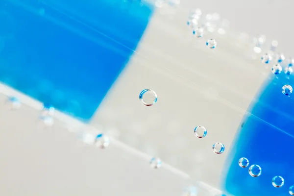 Abstract composition with underwater tubes with colorful jelly balls inside and bubbles — Stock Photo, Image