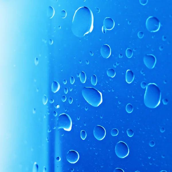 Drops on blue surface — Stock Photo, Image