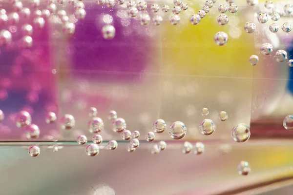 Abstract composition with underwater tubes with colorful jelly balls inside and bubbles — Stock Photo, Image