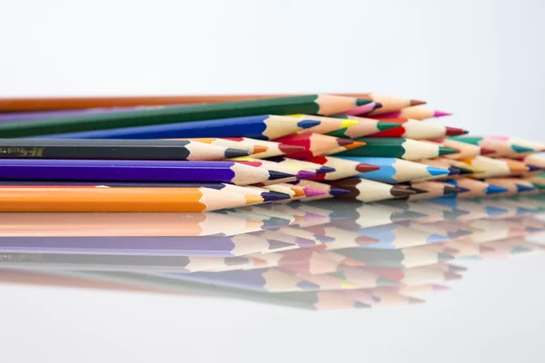 Group of colored pencils with white background and reflexions — Stock Photo, Image