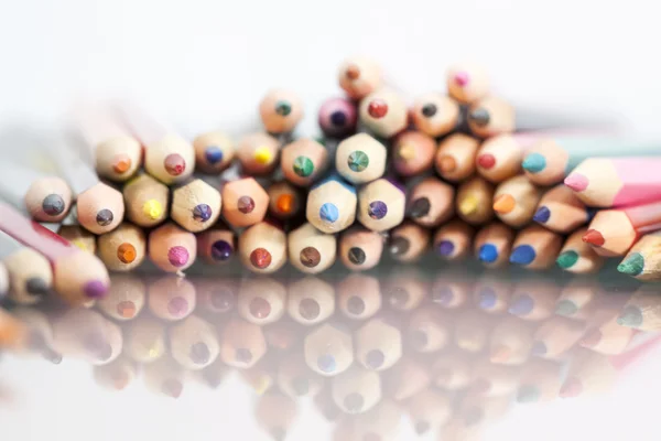 Group of colored pencils with white background and reflexions — Stock Photo, Image