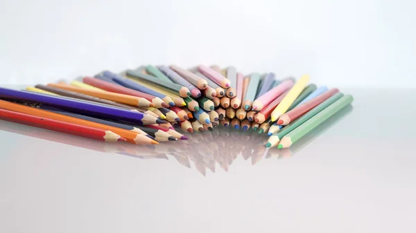 Group of colored pencils with white background and reflexions — Stock Photo, Image