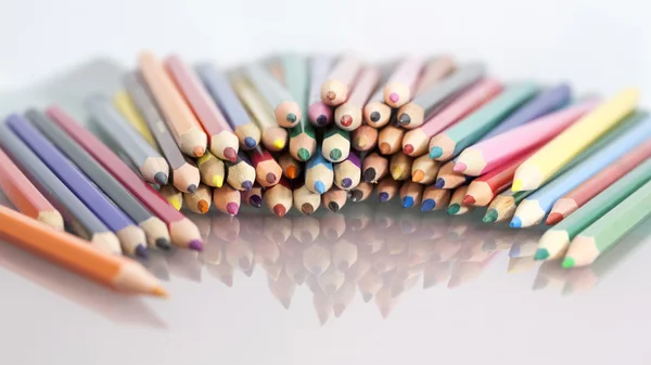 Group of colored pencils with white background and reflexions — Stock Photo, Image