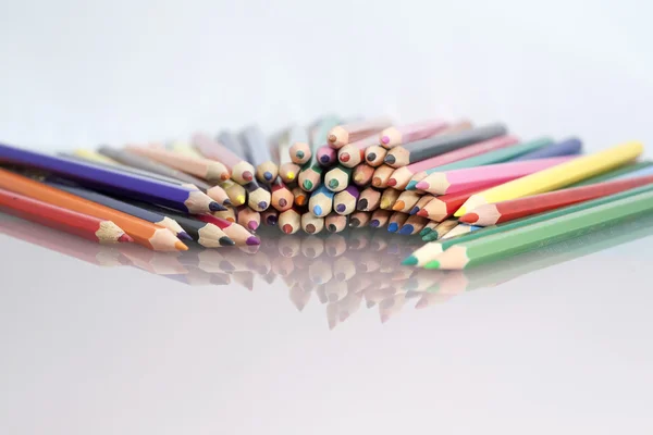 Group of colored pencils with white background and reflexions — Stock Photo, Image