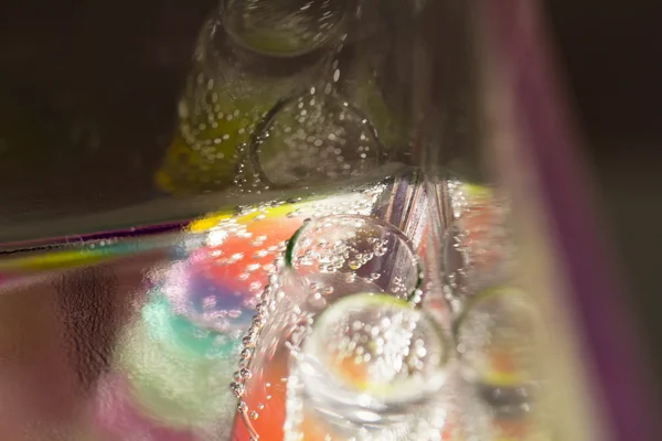 Abstract composition with underwater tubes with colorful jelly balls inside and bubbles — Stock Photo, Image