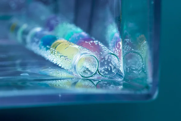 Abstract composition with underwater tubes with colorful jelly balls inside and bubbles — Stock Photo, Image