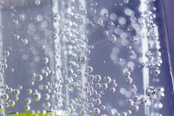 Abstract composition with underwater tubes with colorful jelly balls inside and bubbles — Stock Photo, Image