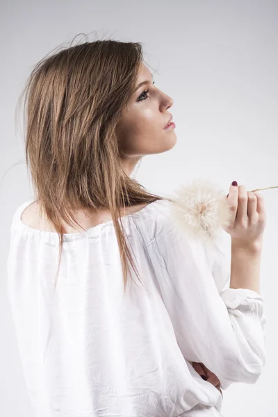 Beautiful caucasian girl wearing a white blouse with light grey background — Stock Photo, Image