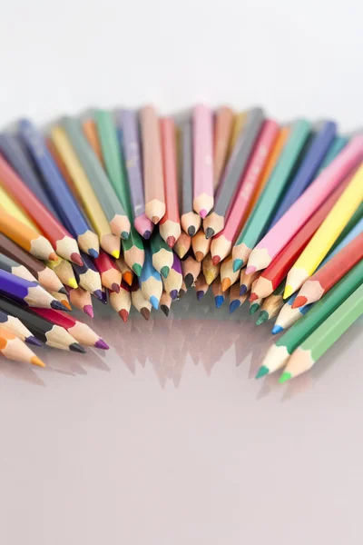 Group of colored pencils with white background and reflexions — Stock Photo, Image