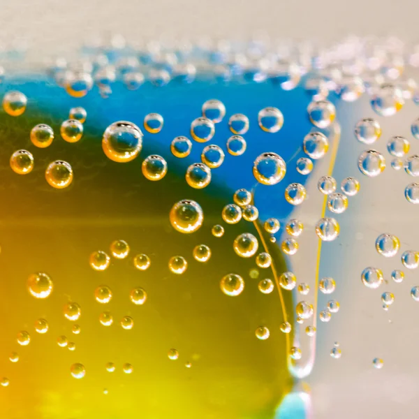 Abstract composition with underwater tubes with colorful jelly balls inside and bubbles — Stock Photo, Image