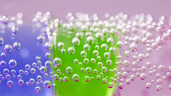 Abstract composition with underwater tubes with colorful jelly balls inside and bubbles — Stock Photo, Image