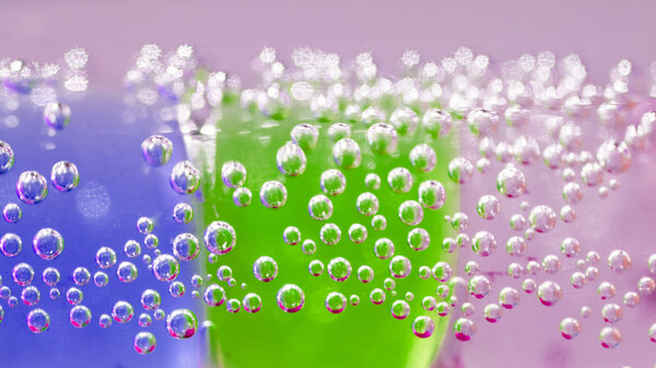 Abstract composition with underwater tubes with colorful jelly balls inside and bubbles