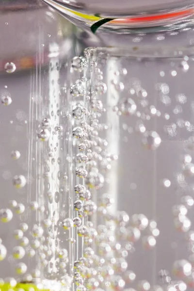 Abstract composition with underwater tubes with colorful jelly balls inside and bubbles — Stock Photo, Image