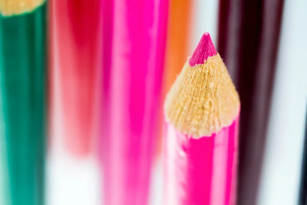 Group of sharp colored pencils with reflexions on dark background — Stock Photo, Image
