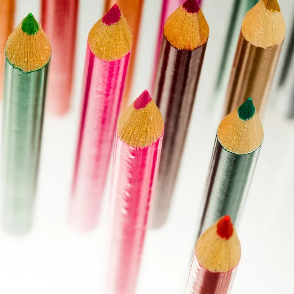 Group of sharp colored pencils with reflexions on dark background — Stock Photo, Image