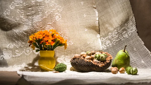 Still life composition with orange flowers and fruits — Stock Photo, Image