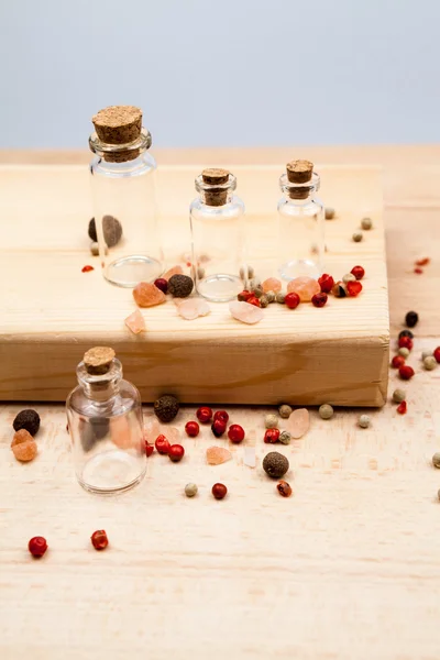 Spices and empty, small glass bottles — Stock Photo, Image