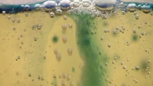 Effervescent mix of oil, water and colorful ink — Stock Video