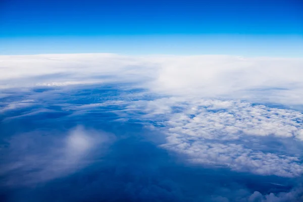 Beautiful, dramatic clouds and sky viewed from the plane — Stock Photo, Image